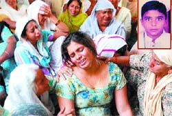 Family members of Class VII student Kulwinder Singh (inset) who was killed in an accident near Phagwara on Wednesday. 