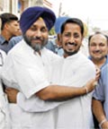 SAD president Sukhbir Badal hugs Amritsar (North) MLA Anil Joshi in Amritsar