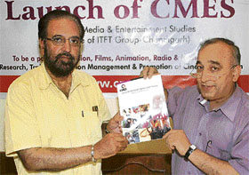 Bollywood director Manmohan Singh (left) at the launch of an entertainment institute in Chandigarh on Thursday. 