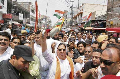 PPCC chief Rajinder Kaur Bhattal brandishes a sword during a rally of the Congress organised in Amritsar on Thursday.