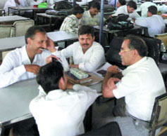 Striking lawyers relax in the canteen of the Tis Hazari Courts in New Delhi on Friday.