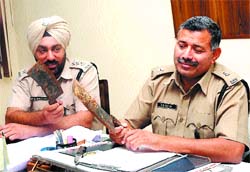 SK Kalia, SP (city 1) shows the meat cleavers allegedly used in the murder of Rita Bawa.