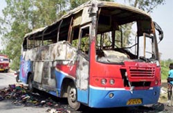 The remains of the charred bus carrying newly-wedded couples from Vadodara in Gujarat