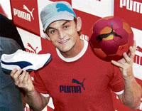 Cricketer Adam Gilchrist launches 'Usan' collection at a Puma store in Hyderabad on Saturday.