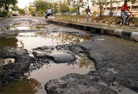 A potholed internal road in the Sector 34 commercial complex in Chandigarh.