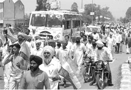Congress workers block traffic on the Patiala-Rajpura highway on Saturday.