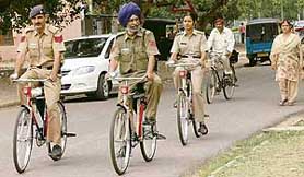 Beat staff ride bicycles patrol Sector 19, Chandigarh, on Saturday.