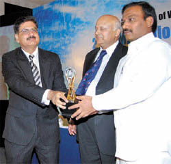 Mukesh Arora, CMD of Teracom, receives the TEMA National Telecom Award  2008 from Union minister for communication & IT A. Raja in New Delhi on Saturday.