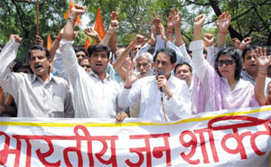 Activists of the Bhartiya Jan Shakti Party protest against the bomb blasts that took place in Jaipur, at Jantar Mantar in New Delhi on Saturday.