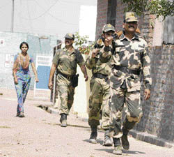After Pakistani militants had made an infiltration bid in the Bainglad area of Samba sector, BSF personnel are seen patrolling the border village of Suchetgarh in Jammu.