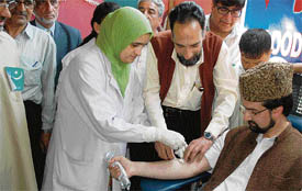 Chairman of the All-Party Hurriyat Conference Mirwaiz Umar Farooq donates blood on the occasion of his father Mirwaiz Maulana Farooqs 18th death anniversary in Srinagar on Saturday.