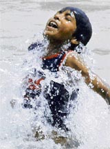 A boy splashes around in Sidhwan Canal, near Ludhiana