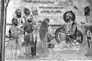 Guru Gobind Singh baptising the Five Beloved Ones