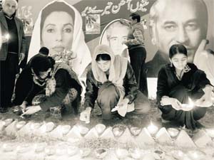 Supporters of the Pakistan Peoples Party hold a candlelight vigil in Lahore after Benazirs assassination in December 2007