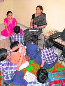 Sushila (right) with HIV orphans at her home in Jaipur
