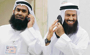 Kuwaiti Islamist candidate Khaled Sultan bin Issa (right) and his representative Hamad al-Namash arrive to cast their votes for the parliamentary elections at a polling station in Kuwait City on Saturday.