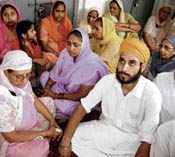 SAD activists outside the office of president of the gurdwara at Ahmedgarh on Sunday