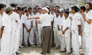 LDCA chairman Chaman Lal interacts with trainees during cricket trials in Ludhiana on Sunday.