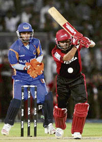 Virender Sehwag hits a boundary during the IPL-T20 match against Rajasthan Royals in Jaipur on Sunday. 