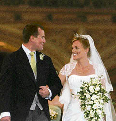 ROYAL BLISS: Britain's Peter Phillips (L) and Canada's Autumn Kelly leave St George's Chapel after their marriage in Windsor, southern England, on Saturday. Peter Phillips is the first of Queen Elizabeth's grandchildren to wed. 