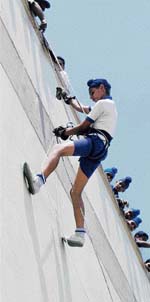 A student of Shemrock School rapples down the school building in Mohali on Saturday. 