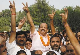 Delhi BJP president Harsh Vardhan with his party supporters celebrates victory in Delhi Cantt. Board election in New Delhi