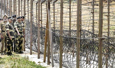 Border Security Force Director-General A.K. Mitra inspects the fencing along with other officers at Samba international border, 60 km from Jammu,