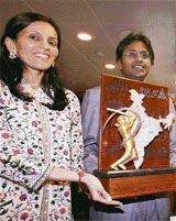 Lalit Modi, chairman and commissioner DLF Indian Premier League (left), along with Mona Mehta chief designer ORRA unveils the Winners trophy in Mumbai, 