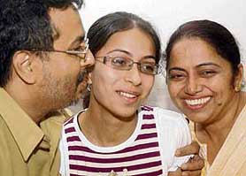 Bableen Kaur Bedi, who topped the Class XII ISCE board exam, with her parents in Chandigarh on Tuesday. 