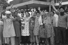 Protesters raise slogans against the government move to shut down a primary health centre in Phase III BI, Mohali, on Tuesday. 