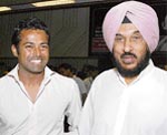Indian tennis player Leander Paes with Gurbachan Singh Randhawa, former versatile hurdler, during the launch of Limca Book of Records-2008 in New Delhi
