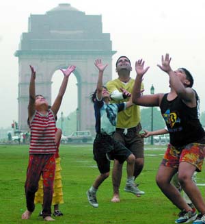 Children enjoy themselves at the India Gate in New Delhi on Wednesday.