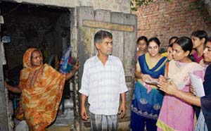 NSS volunteers of GNN College talk to slum dwellers in Doraha on Thursday.