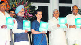 Prime Minister Manmohan Singh with UPA chairperson and Sonia Gandhi and other leaders during the release of report on the occasion of the fourth anniversary  of the UPA government in New Delhi on Thursday.
