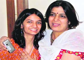 The topper, Pallavi Jain, with her mother Alka Jain in a jubilant mood at their house in Gurgaon