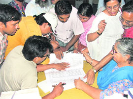 Parents of Class-VIII students see the gazette at Punjabi Bhawan in Ludhiana on Friday. 