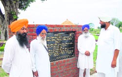 SGPC member Satwinder Tohra (extreme left), along with others, at the park created in memory of Gurcharan Singh Tohra at Tohra village