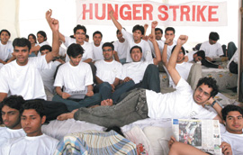 Students of Maulana Azad Medical College observe a hunger strike on the college campus against the proposed OBC reservation policy in New Delhi on Saturday .