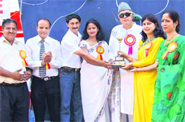 Former Jammu and Kashmir chief minister Farooq Abdullah being felicitated at a function organised to dedicate the newly constructed Tenzing Norgay sport climbing wall to students of Sprawling Buds School in Jammu on Saturday. 