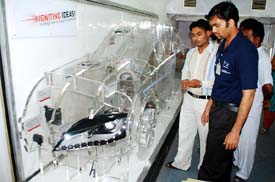 Visitors having a look at the future car designed by the German scientists.