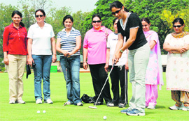 Simrat Kaur putts the ball at the Chandigarh Golf Range on Sunday.