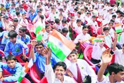Schoolchildren during the inauguration of an extension campus of the Jammu University at Bhaderwah, 270 km from Jammu on Sunday.