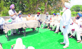 PAU scientist addresses farmers of Bilaspur village during the special one-day camp in Doraha on Sunday.