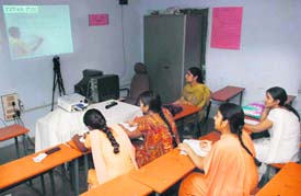 Students of the Government Girls Senior Secondary School, Bathinda, take the help of Edusat programme.