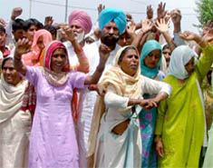Residents of Samagh village protesting against bunglings in Panchayat elections outside Muktsar DCs residence on Monday