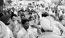 Voters protest against Election Commission during voting at Dhamoli village near Rajpura on Monday