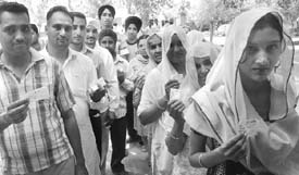 Voters queue up for voting at Manoli village in Mohali.