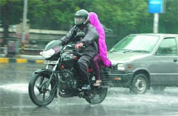 A couple caught in a sudden heavy shower in New Delhi