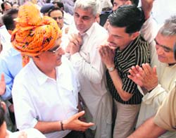 Chief Minister Bhupinder Singh Hooda accepts greetings of Congress workers at his residence in Chandigarh on Monday.