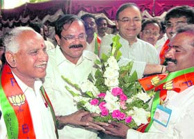 BJP chief ministerial candidate for Karnataka B.S. Yeddyurappa (left) with senior party leaders ahead of the legislative party meeting in Bangalore